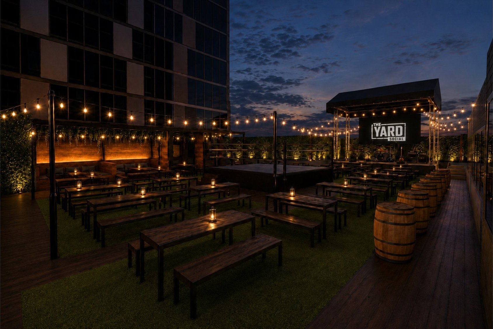 The Yard Social at dusk — open-air venue with ring and big screens
